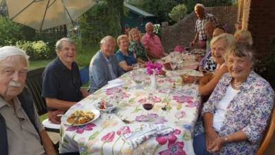 Members of the Committee enjoying their meal, hosted by Sidney and Evelyne Denham.