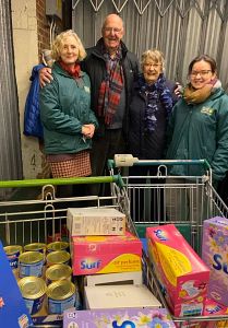 Rotarian Bob Anderson and his wife Jenny with members of the Canterbury Food Bank Team who take on our latest donations. 