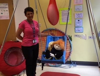 Jane Flockhart, Manager of the Nursery, pictured with the swing.