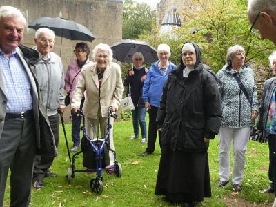 Members, partners and friends are shown around the Abbey grounds. 