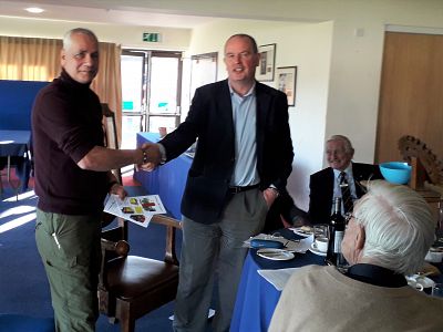 President Neil Fraser gives the donation to Steve Mellers during our meeting. 