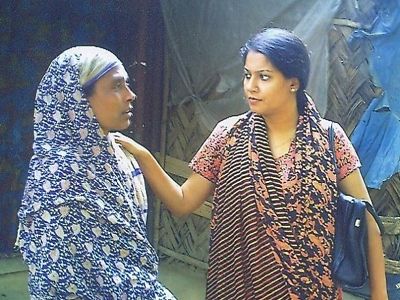 Rizwana comforts the mother of an eighteen-year old who had lost his life while working at a shipbreaking yard