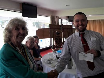 President Margaret Griffin hands over the cheque to Tesco