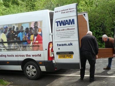 Loading the knitting machine onto the TWAM van.